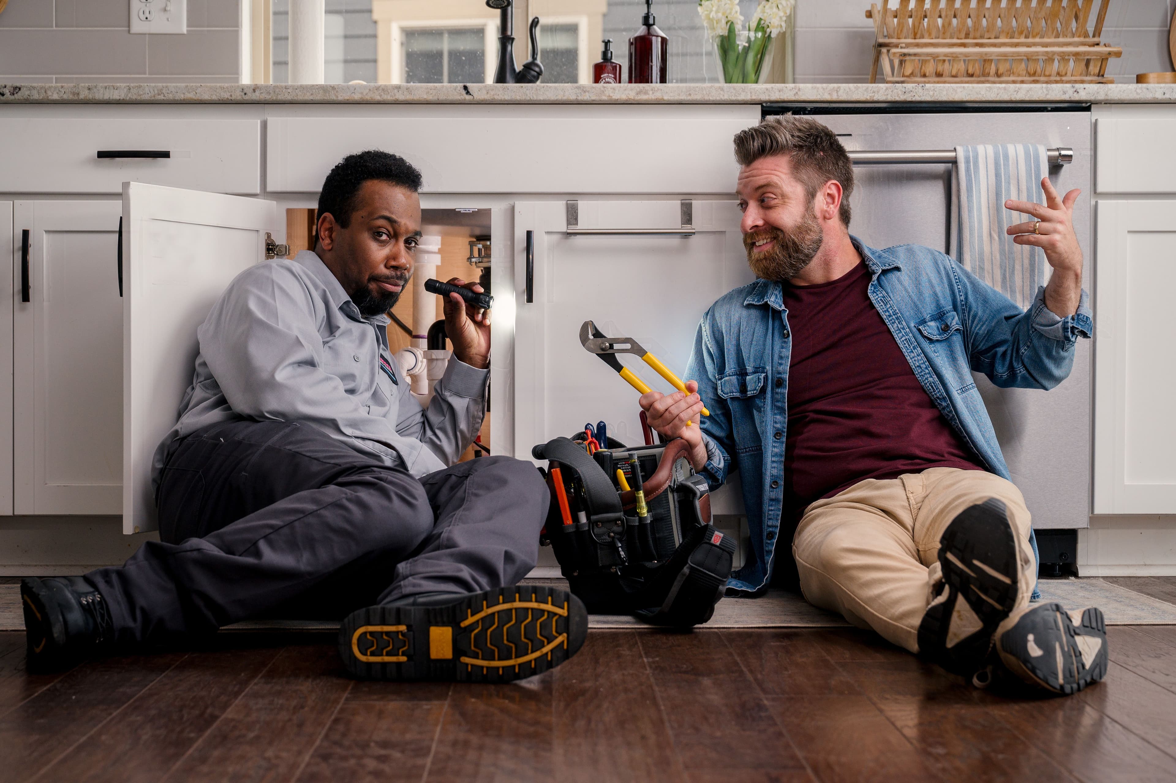 plumber with homeowner