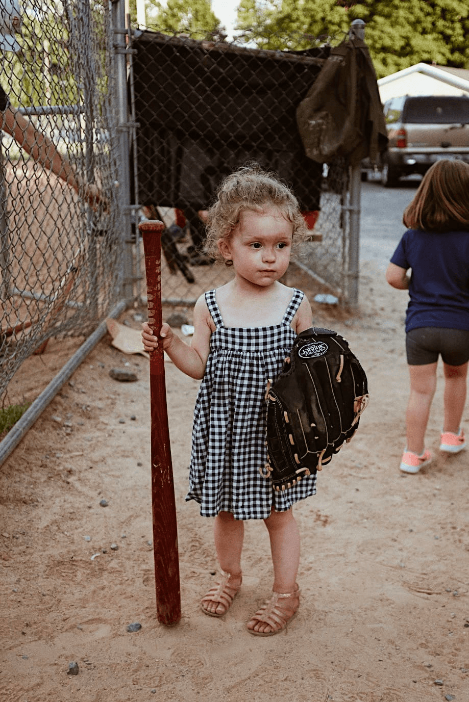 girl and baseball bat